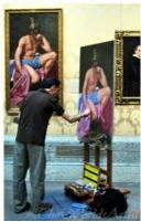 The worlds artist painting a reproduction copy in a museum